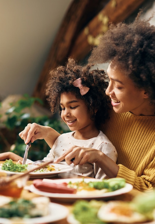 Mother eating a healthy lunch with her daughter